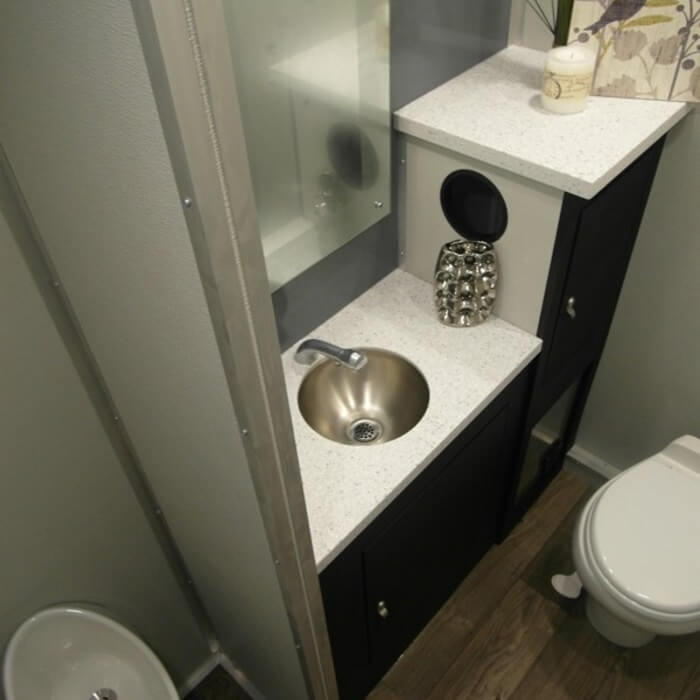 Moon Portable Restrooms Porta Lisa Interior sink, toilet, and urinal.