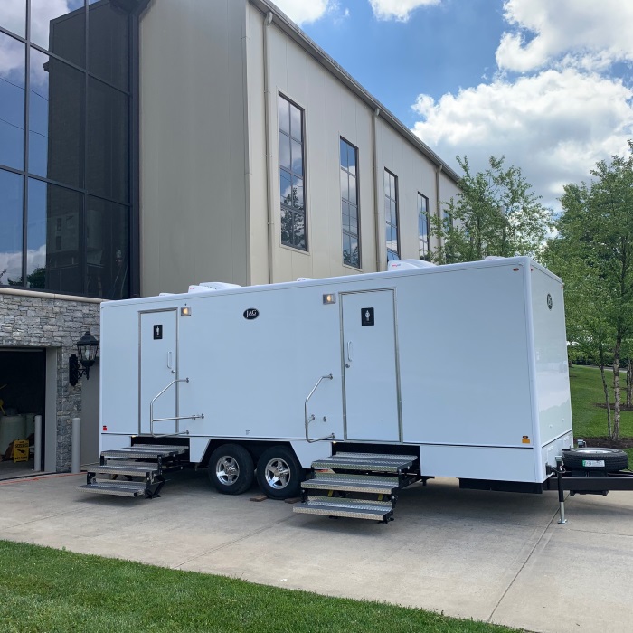 Side view of Moon restroom trailer at an event